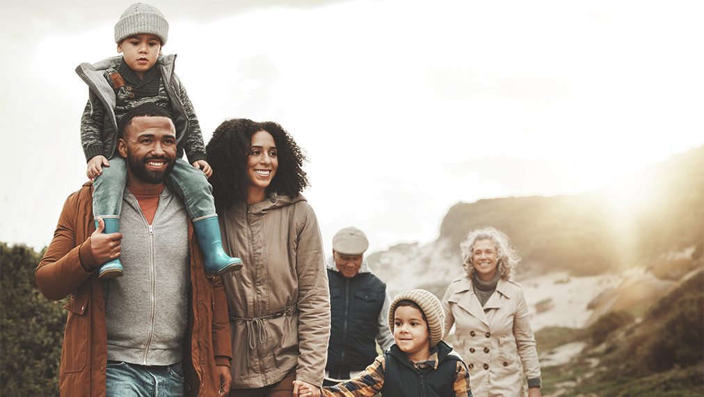 Happy family hiking together